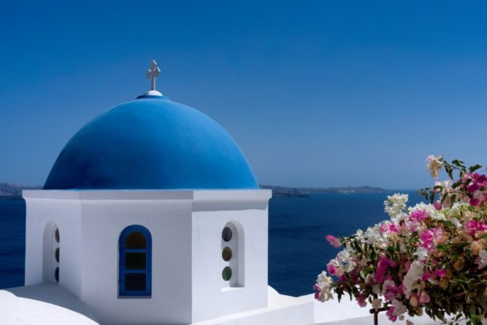 Santorini's timeless white-and-blue color scheme makes a classic wedding backdrop. 