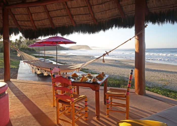 The open-air dining palapa at Las Alamandas resort.